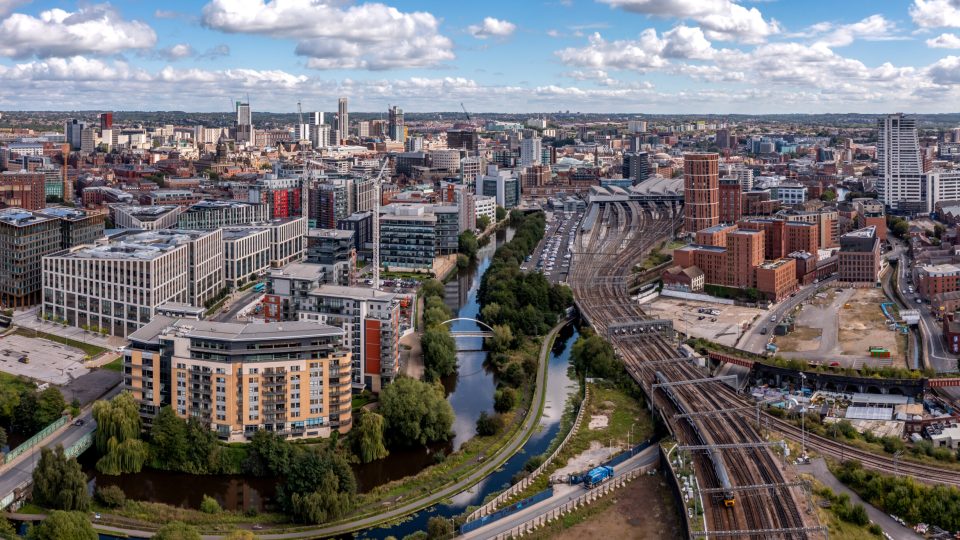 LEEDS, UK - AUGUST 15, 2023.  An aerial panoramic view of Leeds cityscape skyline with railway station and Granary Wharf area of the Yorkshire city