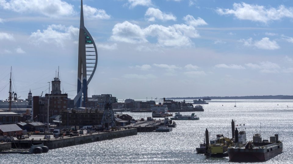The harbor area and Spinnaker Tower in the city of Portsmouth on the south coast of England in the United Kingdom.